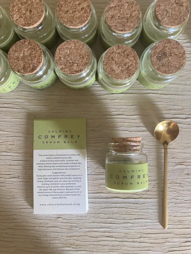 Radiant Rosehip serum balm with its ingredient card and gold spoon